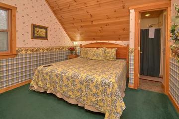 Cabin rental's second bedroom with king bed.